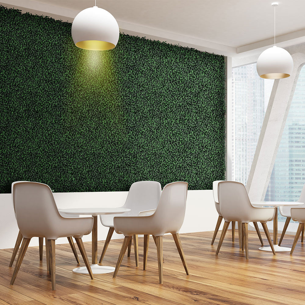 Artigwall artificial boxwood roll panel on wall behind table and chairs