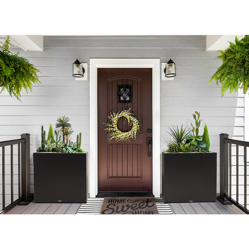 Large rectangular black metal planter box by Artigwall on front porch