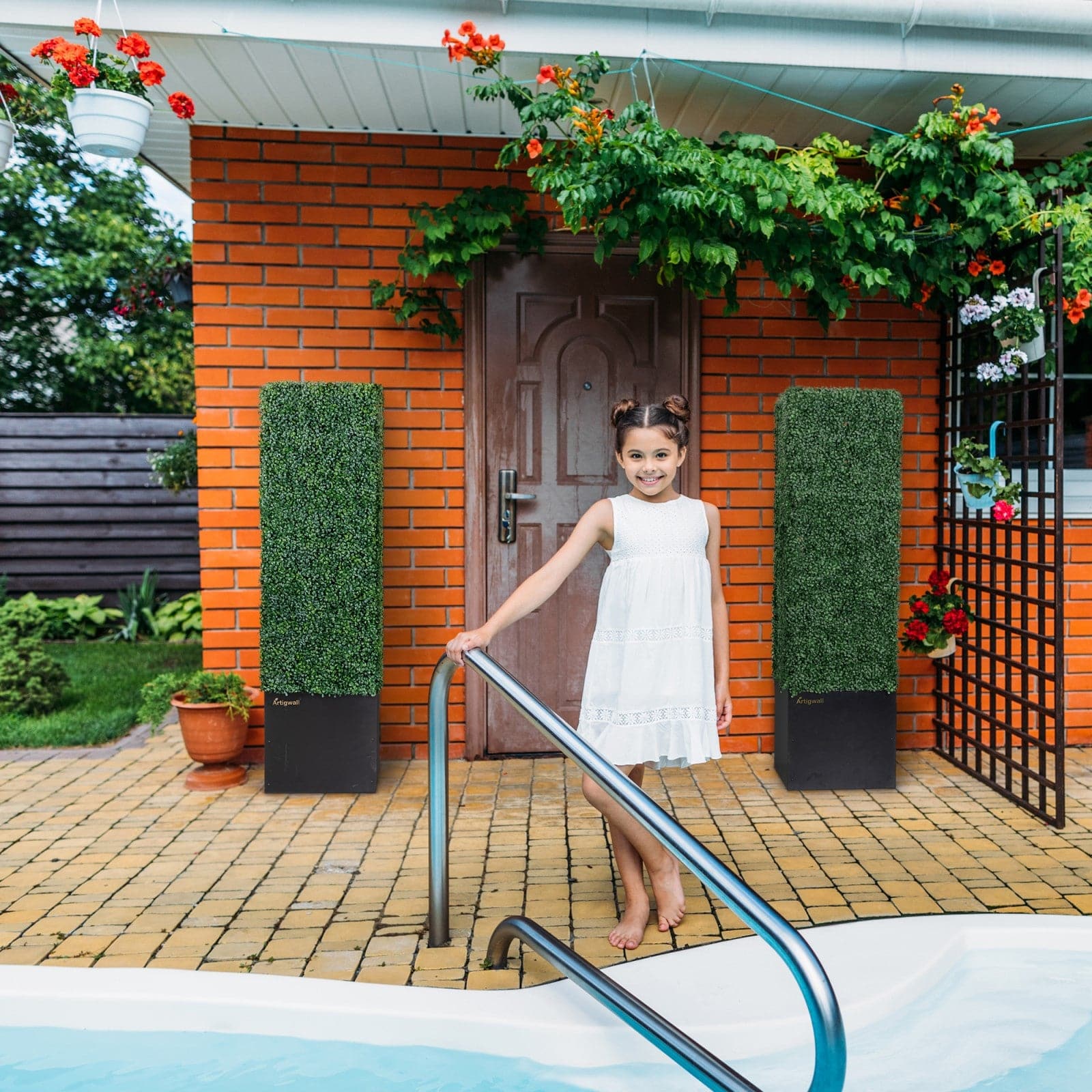 Artigwall boxwood topiary tree used by the pool